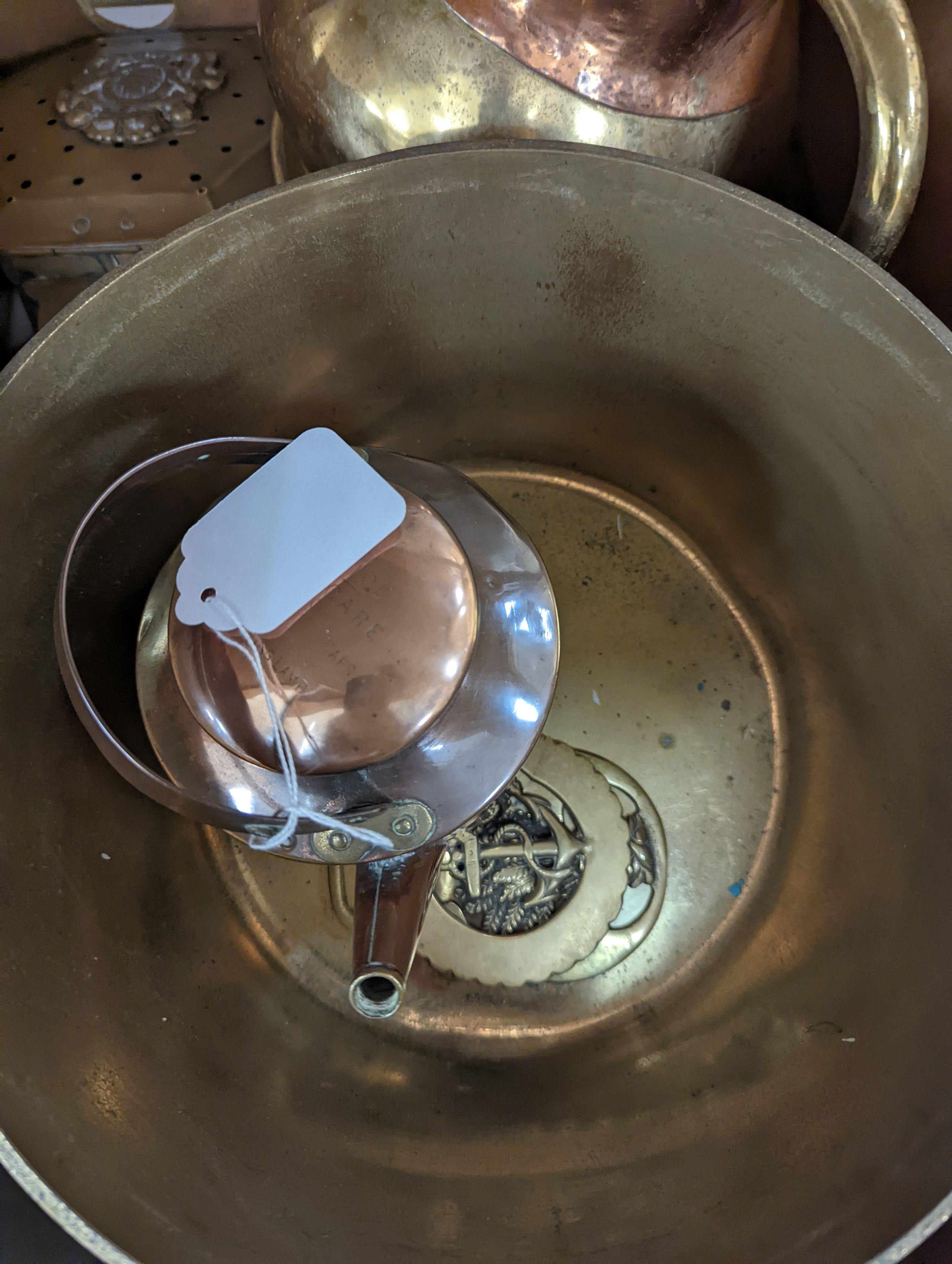 A quantity of copper and brass wares